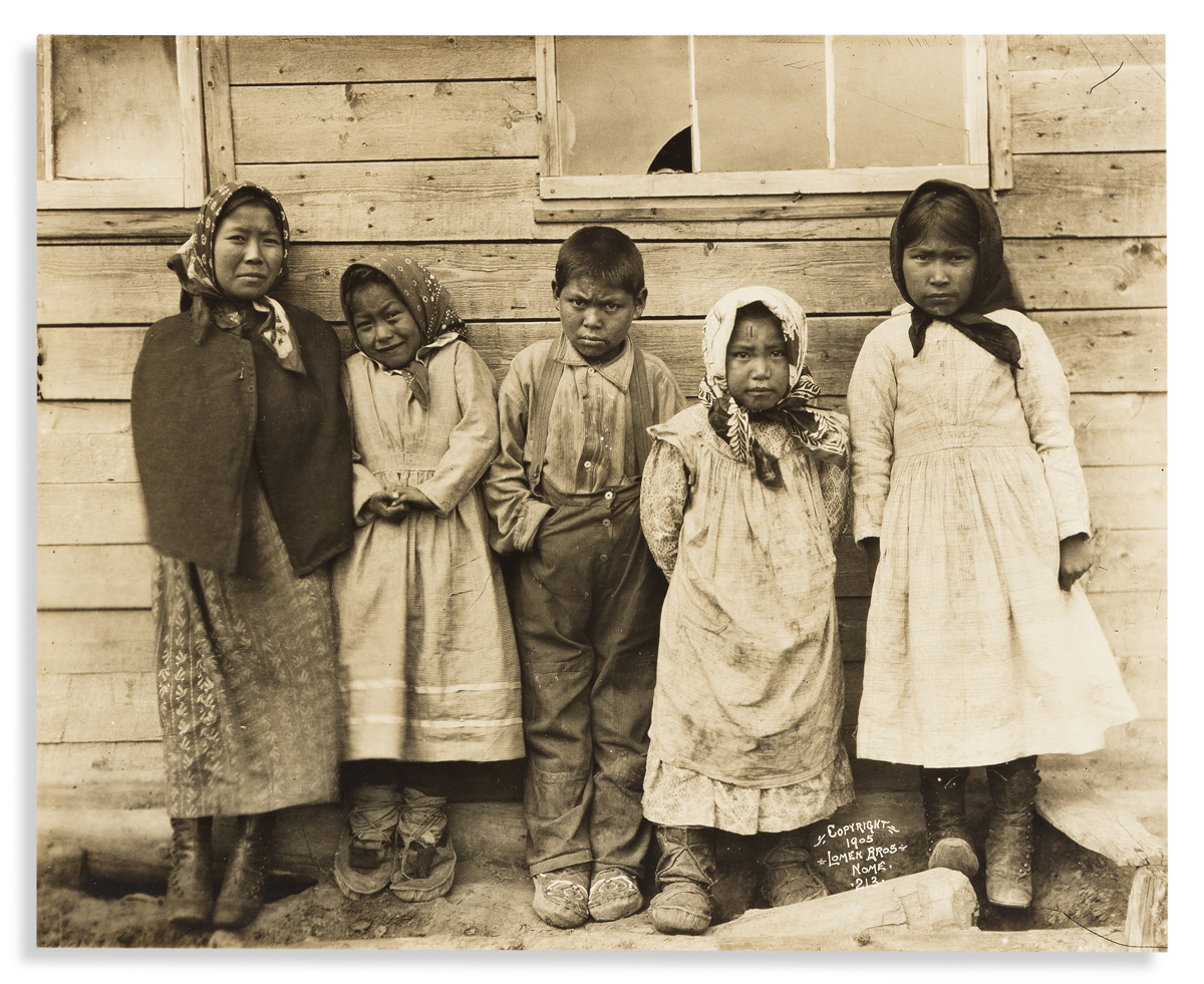 (ALASKA.) Lomen Brothers, photographers. Photograph of 5 Inuit children in Nome.